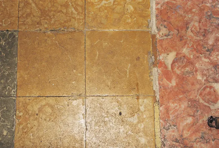 Worn yellow limestone beside pink marble