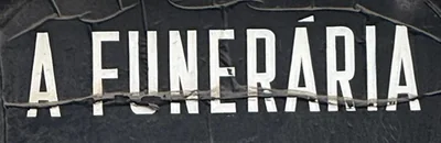 Weathered sign reading A Funerária, the closed funeral home in Anjos that inspired the issue
