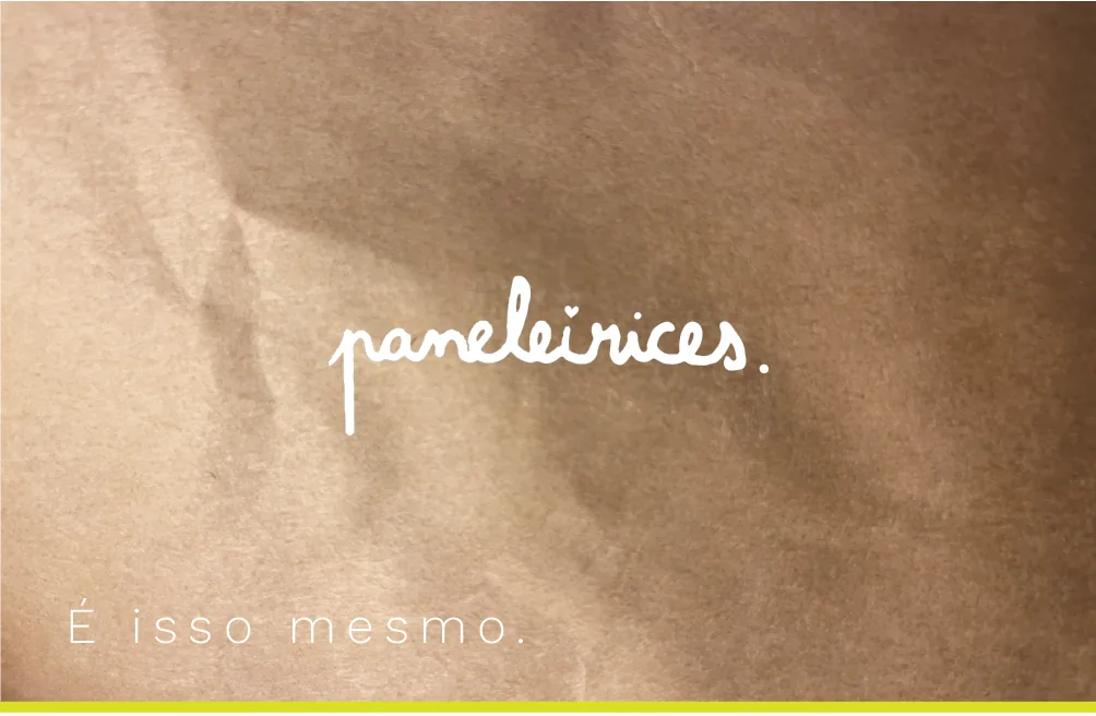 Business card in kraft paper with the handwritten logo in white