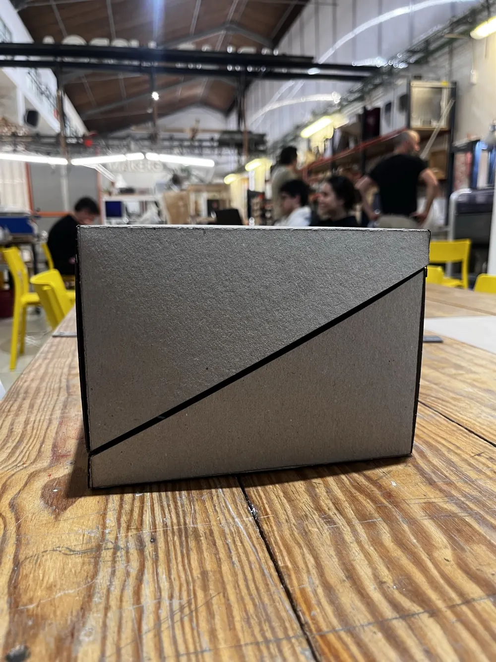 The closed box seen from the front, with a diagonal cut across its face