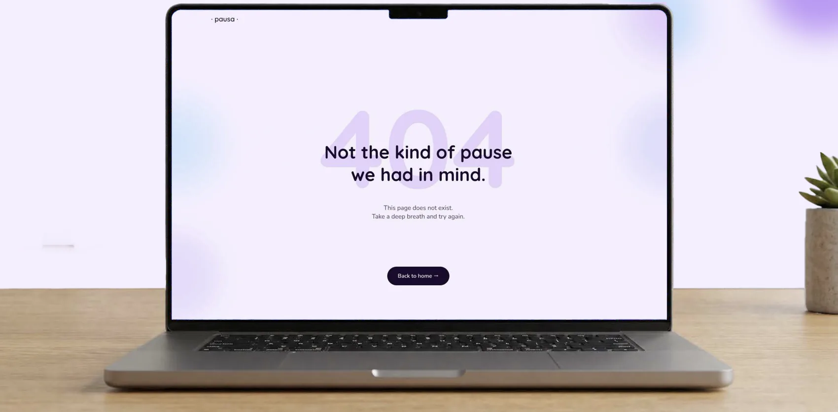 The 404 page on a laptop: “Not the kind of pause we had in mind.”