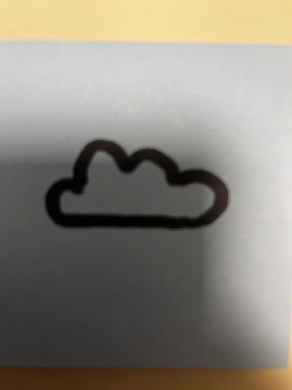 A cloud outline drawn in marker