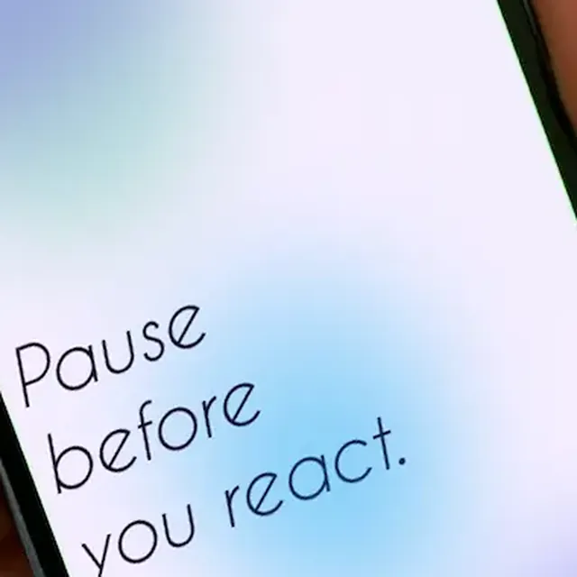 Pausa: close-up of the app screen, “Pause before you react.”