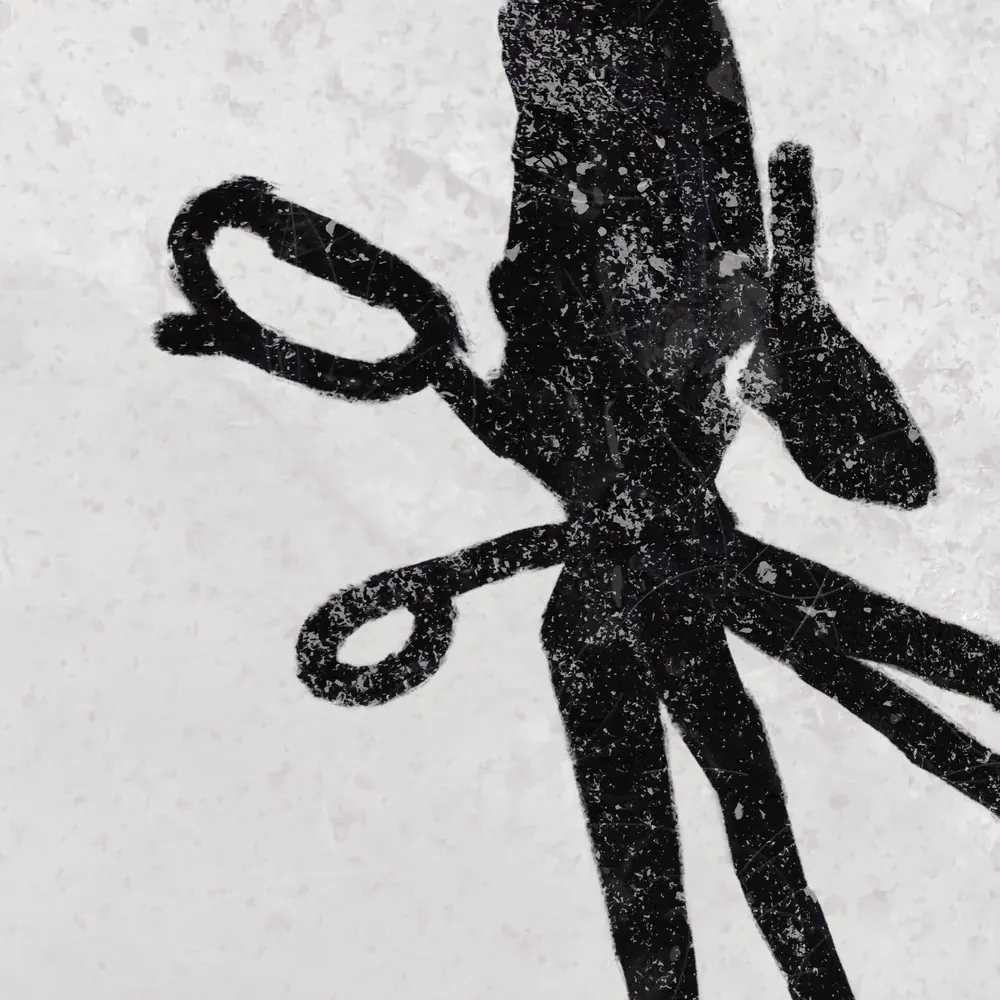 Close-up of the Edward Scissorhands poster: black scissor hands on frosty gray